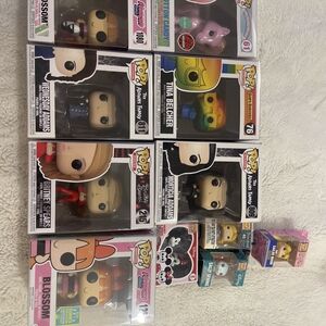 Funko Pop Vinyl Figures with Red, Blue, and Pink Accents